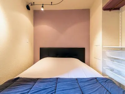 Un ou plusieurs lits dans un hébergement de l'établissement Apartment Home Club - Lavachet-10 by Interhome