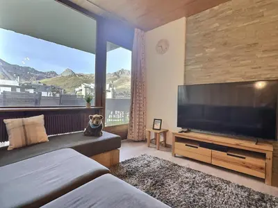 Télévision ou salle de divertissement dans l'établissement Appartement Tignes 2100 - 4-6 personnes - 1 chambre - 4 lits - Wifi haut débit - Parking couvert inclus
