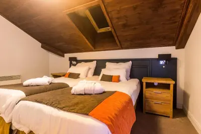 Un ou plusieurs lits dans un hébergement de l'établissement Résidence Les Arcs 1950 Le Village - maeva Home - Appartement 3 pièces 6 personnes vue sur le Mont Blanc - Prestige - super Home MAE-4490
