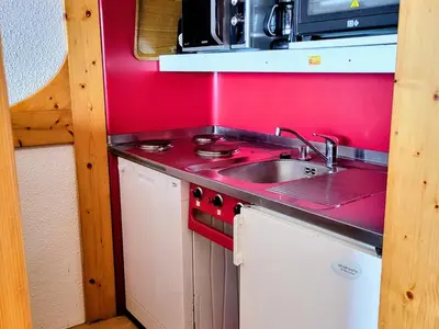 Cuisine ou kitchenette dans l'établissement Appartement 6 pers · Balcon · Wifi gratuit · Parking - FR-1-346-559