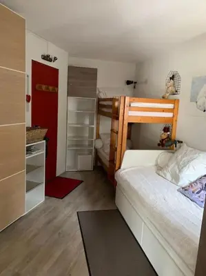 Un ou plusieurs lits dans un hébergement de l'établissement Studio Arc 2000