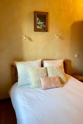 Un ou plusieurs lits dans un hébergement de l'établissement Chalet typique accueillant jusqu'à 9 personnes