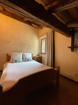 Un ou plusieurs lits dans un hébergement de l'établissement Chalet typique accueillant jusqu'à 9 personnes