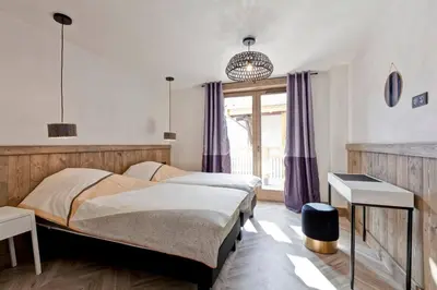 Un ou plusieurs lits dans un hébergement de l'établissement Lodge 10 personnes proche pistes et commerces belle vue