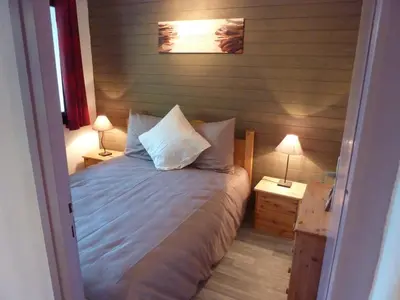 Un ou plusieurs lits dans un hébergement de l'établissement Chalet le chamois