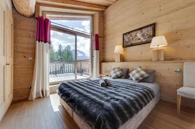 Un ou plusieurs lits dans un hébergement de l'établissement CHALET AROLAY