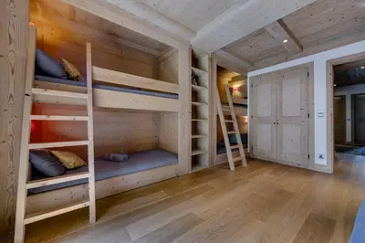 Un ou plusieurs lits dans un hébergement de l'établissement CHALET AROLAY
