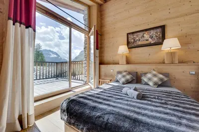 Un ou plusieurs lits dans un hébergement de l'établissement CHALET AROLAY