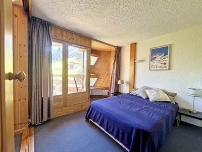 Un ou plusieurs lits dans un hébergement de l'établissement 2 pièces ski aux pieds, balcon sud, Val d'Isère - FR-1-518-150