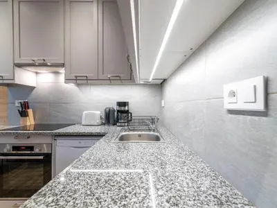 Cuisine ou kitchenette dans l'établissement Apartment Le Hameau du Borsat - Val Claret-14 by Interhome