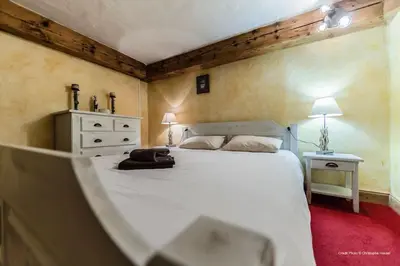 Un ou plusieurs lits dans un hébergement de l'établissement Chalet Ancolie