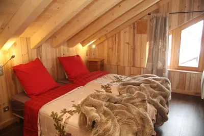 Un ou plusieurs lits dans un hébergement de l'établissement Chalet Pomme de Pin