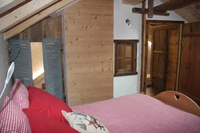 Un ou plusieurs lits dans un hébergement de l'établissement Chalet Pomme de Pin