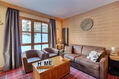 Coin salon dans l'établissement Appartement T3 ARC 1950 skis aux pieds Sauna, Hammam, Jacuzzi
