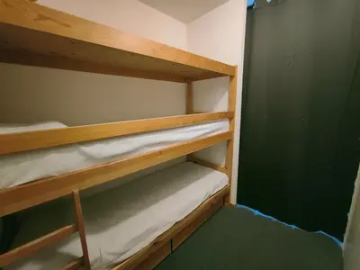 Un ou plusieurs lits dans un hébergement de l'établissement Arc 2000 - Charmant appartement 4 personnes, chambre séparée, calme et en plein centre
