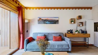 Coin salon dans l'établissement Ski & Spa 4 p, Résidence avec Piscine