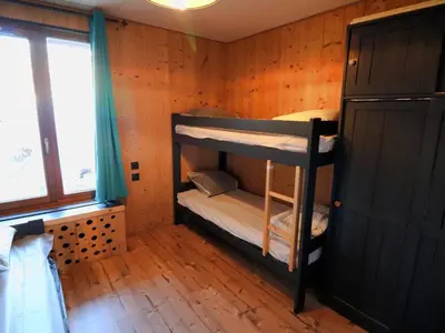 Un ou plusieurs lits dans un hébergement de l'établissement Appartement confortable au pied des pistes - 6 personnes - FR-1-502-546