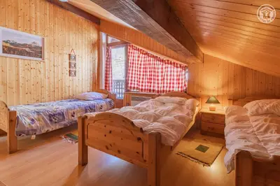 Un ou plusieurs lits dans un hébergement de l'établissement Magnifique chalet Mistouflon