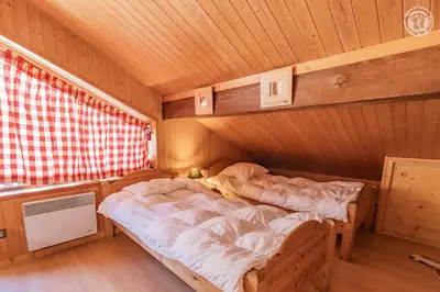 Un ou plusieurs lits dans un hébergement de l'établissement Magnifique chalet Mistouflon