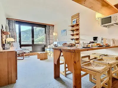Coin salon dans l'établissement 2 pièces 5 pers aux pieds des pistes à Val d'Isère - FR-1-411-916