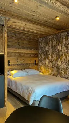 Un ou plusieurs lits dans un hébergement de l'établissement Résidence GRAND COCOR, Skis aux pieds -Studio 25 m2- by MONTBLANC LOGDE