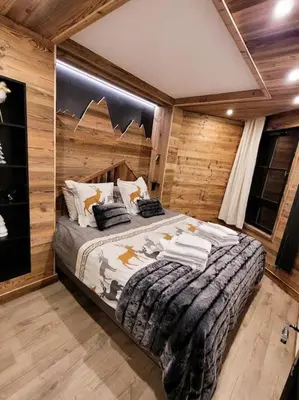 Un ou plusieurs lits dans un hébergement de l'établissement LES ARCS Appartement Prestige Ski In Ski Out