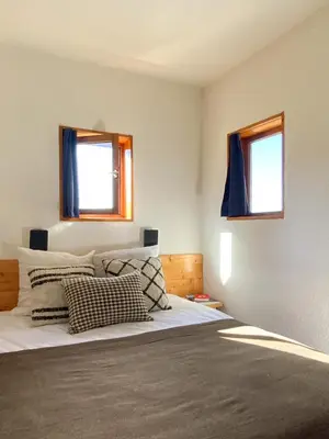 Un ou plusieurs lits dans un hébergement de l'établissement Appartement Perriand Les Arcs 1800