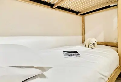 Un ou plusieurs lits dans un hébergement de l'établissement Résidence Val D'illaz - Agréable appartement 2 pièces cabine pour 6 personnes situé à Val d'Isère, proche du centre de la station MAE-5101