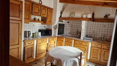 Cuisine ou kitchenette dans l'établissement Au Fil du Temps
