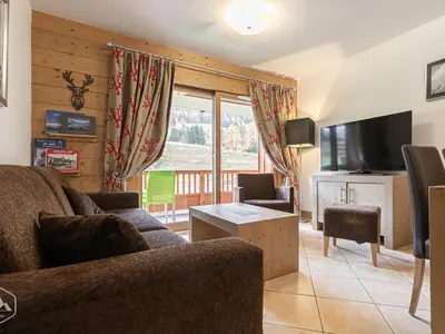 Télévision ou salle de divertissement dans l'établissement Appartement Confort 4 Cimes Ski aux Pieds, Piscine, Sauna, Hammam, Parking Val Cenis - FR-1-508-300