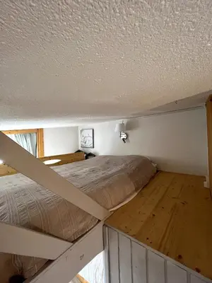 Un ou plusieurs lits dans un hébergement de l'établissement Duplex Belles Challes