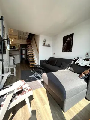 Coin salon dans l'établissement Duplex Belles Challes
