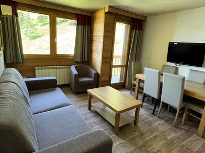 Télévision ou salle de divertissement dans l'établissement Résidence Le Centaure - Appartement agréable · Ski aux pieds MAE-0601