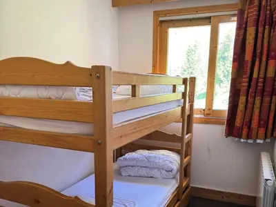 Un ou plusieurs lits dans un hébergement de l'établissement Résidence Le Centaure - Appartement fonctionnel · Résidence avec accès direct aux pistes MAE-0641