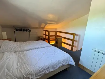 Un ou plusieurs lits dans un hébergement de l'établissement Duplex cosy à Belle Plagne - Ski aux pieds, balcon, piscine, bien-être, animaux admis - FR-1-181-2821