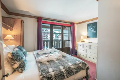 Un ou plusieurs lits dans un hébergement de l'établissement 4009 loft penthouse Prince des Cimes Arc 1950