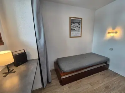 Un ou plusieurs lits dans un hébergement de l'établissement Studio confortable 4 pers. au pied des pistes avec balcon - FR-1-502-564