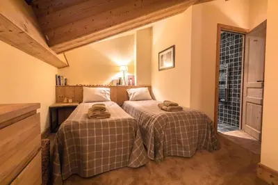 Un ou plusieurs lits dans un hébergement de l'établissement L'Aquila 34 - 3-bedroom ski-in ski-out apartment
