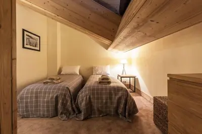 Un ou plusieurs lits dans un hébergement de l'établissement L'Aquila 34 - 3-bedroom ski-in ski-out apartment