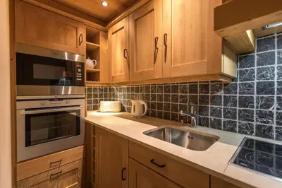 Cuisine ou kitchenette dans l'établissement L'Aquila 34 - 3-bedroom ski-in ski-out apartment