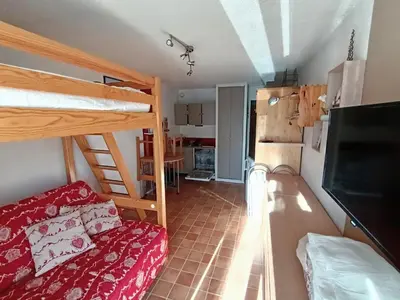 Un ou plusieurs lits dans un hébergement de l'établissement Studio Aussois chaleureux
