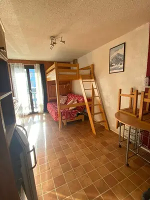 Un ou plusieurs lits dans un hébergement de l'établissement Studio Aussois chaleureux