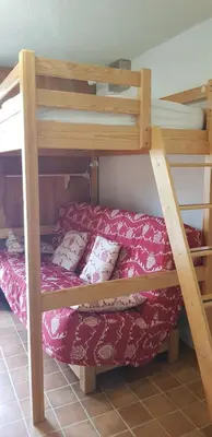Un ou plusieurs lits dans un hébergement de l'établissement Studio Aussois chaleureux