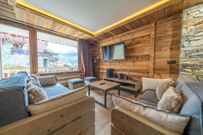 Télévision ou salle de divertissement dans l'établissement Appartement Le Rosset