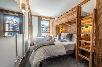 Un ou plusieurs lits dans un hébergement de l'établissement Appartement 4-5 personnes skis aux pieds piscine intérieure sauna hammam