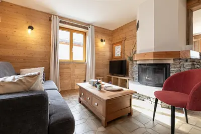 Coin salon dans l'établissement Appartement La Mottuaz