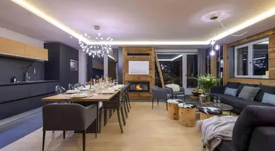 Coin salon dans l'établissement Luxueux duplex accès direct aux pistes avec piscine privée