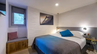 Un ou plusieurs lits dans un hébergement de l'établissement Luxueux duplex accès direct aux pistes avec piscine privée