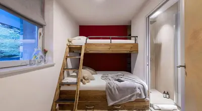Un ou plusieurs lits dans un hébergement de l'établissement Luxueux duplex accès direct aux pistes avec piscine privée