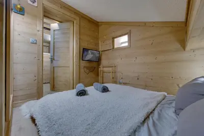 Un ou plusieurs lits dans un hébergement de l'établissement CHANTELOUVE Tres bel appartement avec une jolie Vue